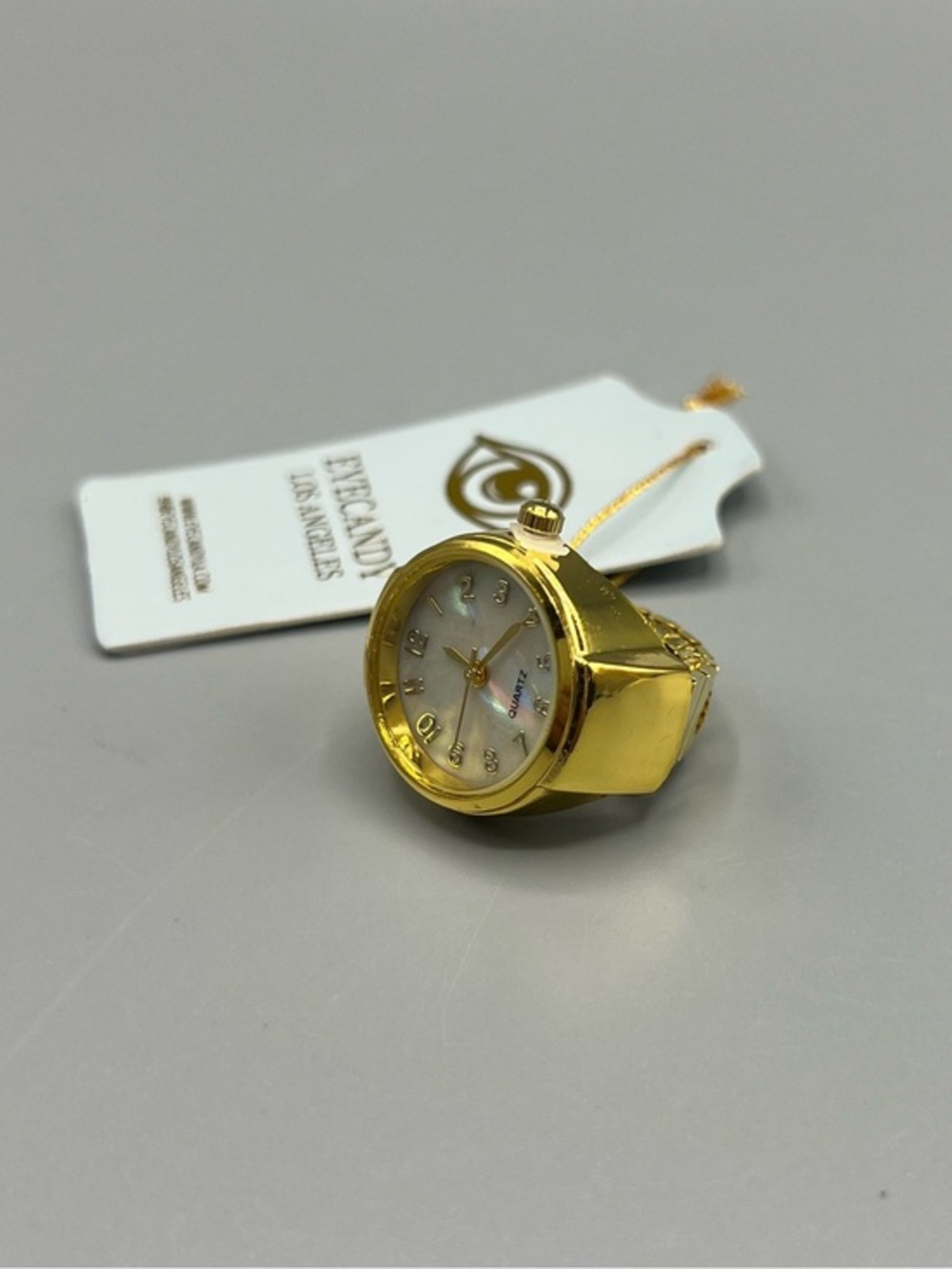 Eye Candy Gold Tone Ring Watch with Mother of Pearl Dial